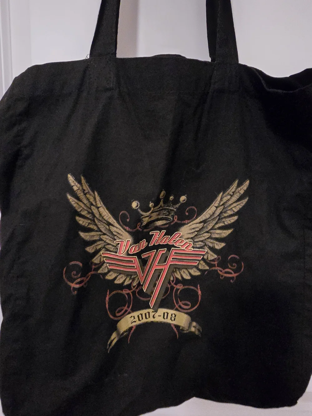Black Graphic Tote Bag with Gold Accent Design